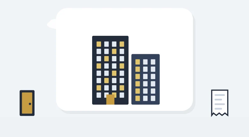 Two apartment blocks with lit windows