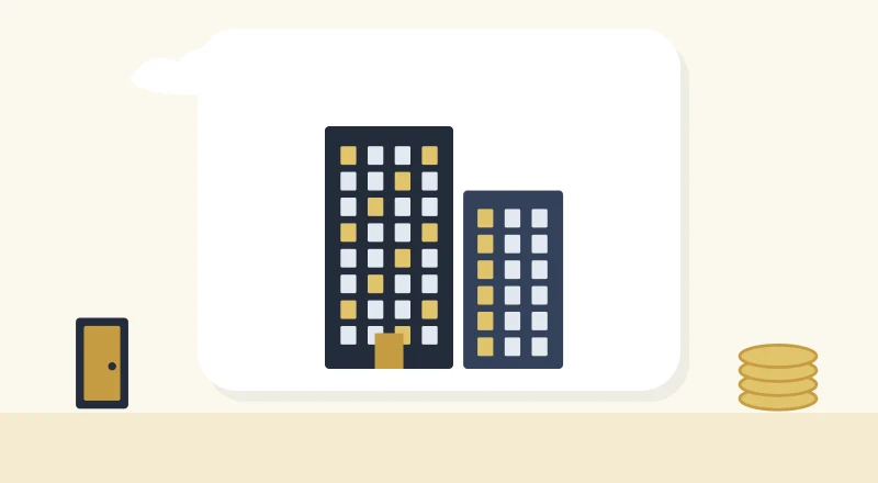 Two apartment blocks with lit windows