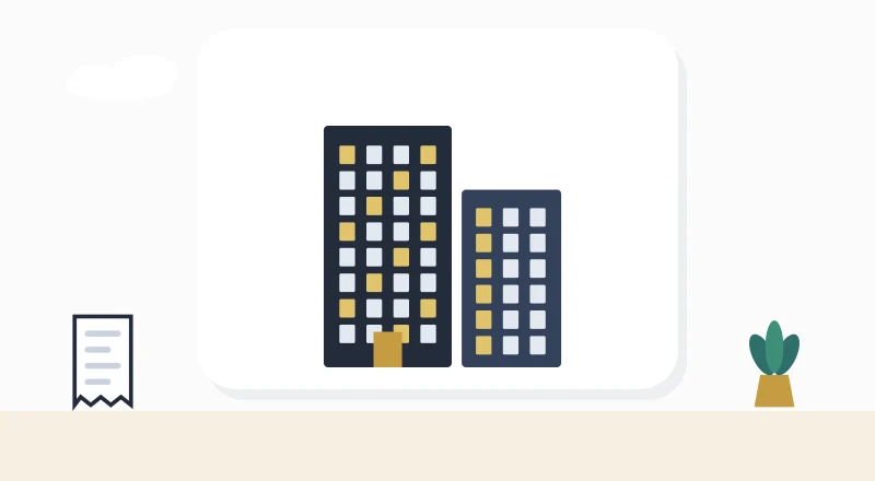 Two apartment blocks with lit windows