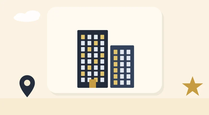 Two apartment blocks with lit windows