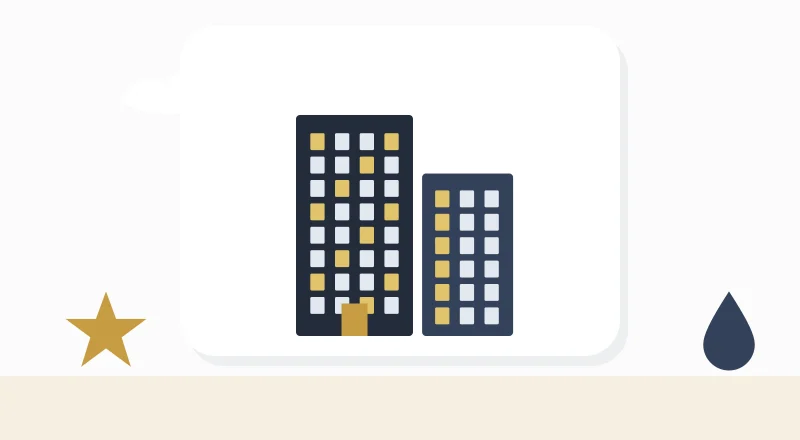 Two apartment blocks with lit windows