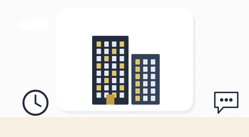 Two apartment blocks with lit windows