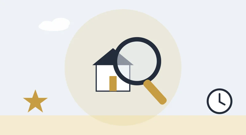 A magnifying glass over a house