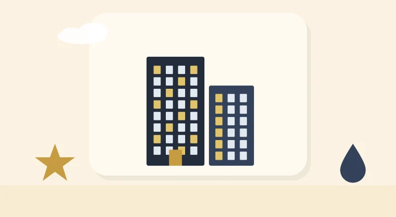Two apartment blocks with lit windows