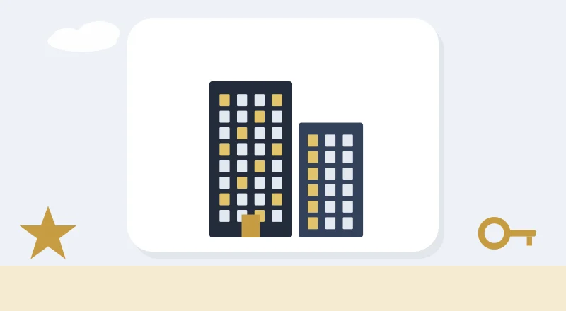 Two apartment blocks with lit windows