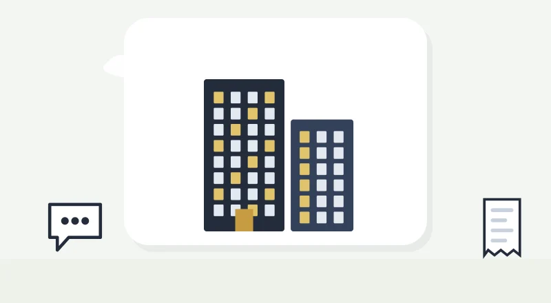 Two apartment blocks with lit windows