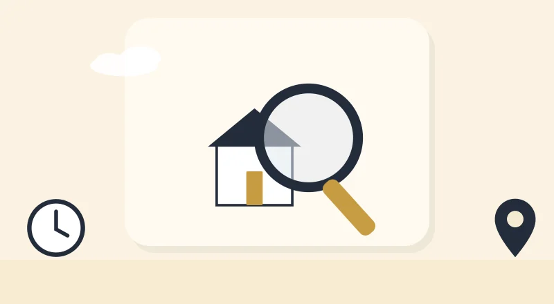 A magnifying glass over a house