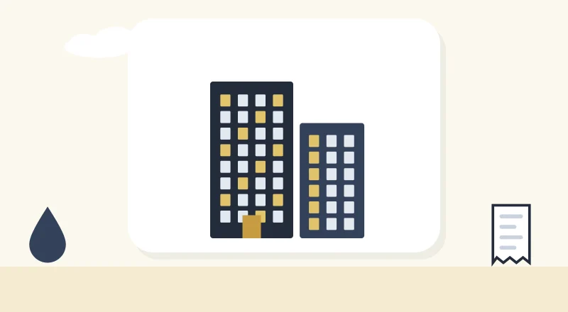 Two apartment blocks with lit windows