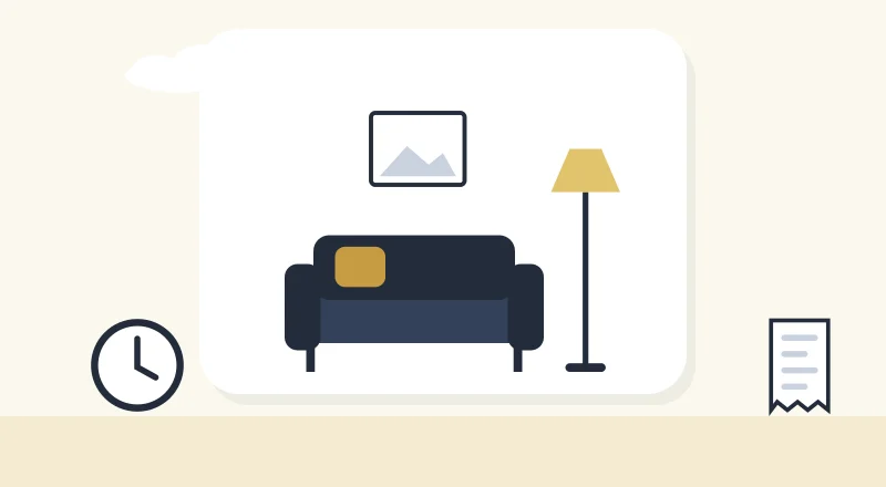 A cosy living room with a sofa and a lamp