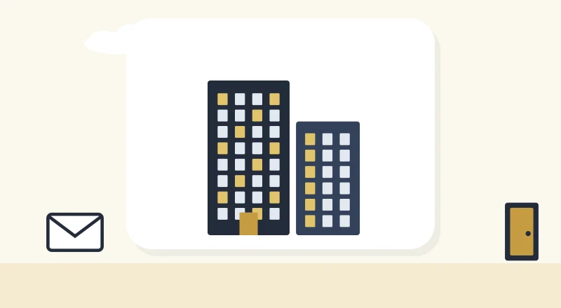 Two apartment blocks with lit windows