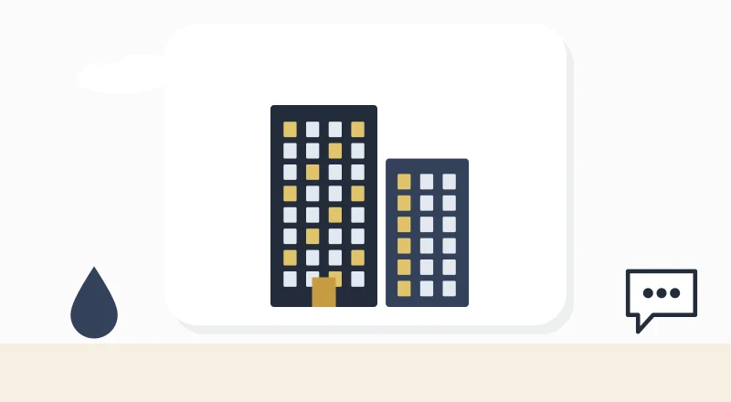 Two apartment blocks with lit windows