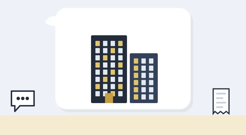 Two apartment blocks with lit windows