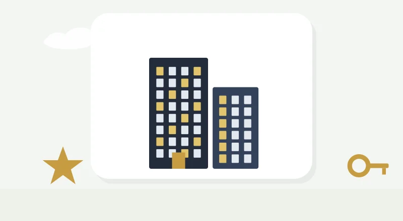 Two apartment blocks with lit windows