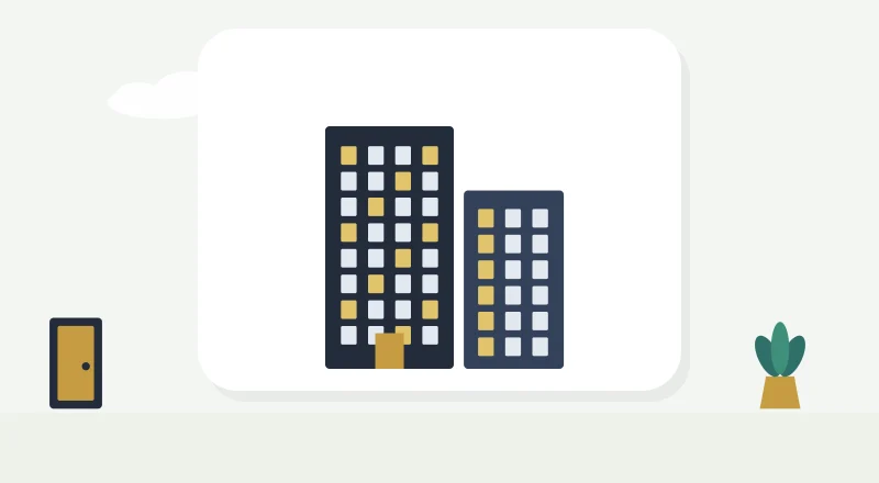 Two apartment blocks with lit windows