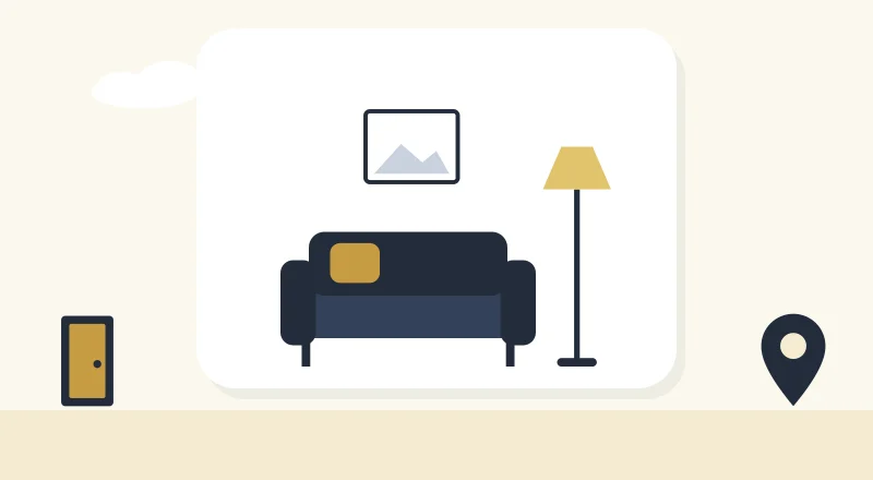 A cosy living room with a sofa and a lamp