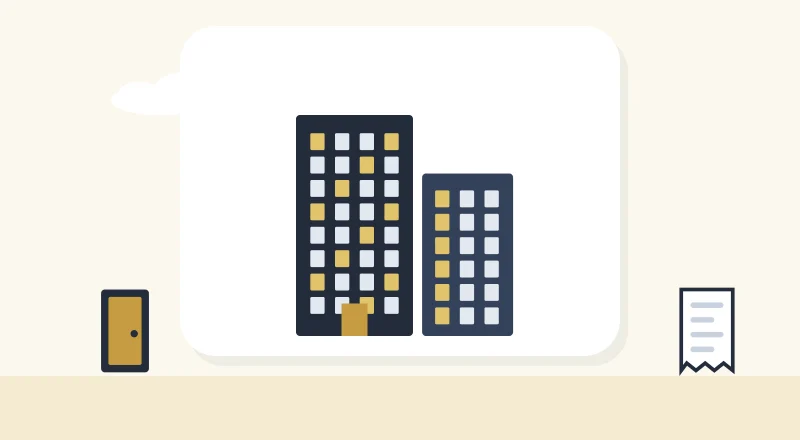 Two apartment blocks with lit windows