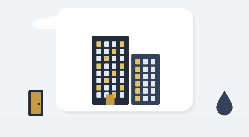 Two apartment blocks with lit windows