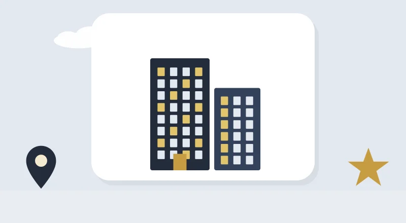 Two apartment blocks with lit windows