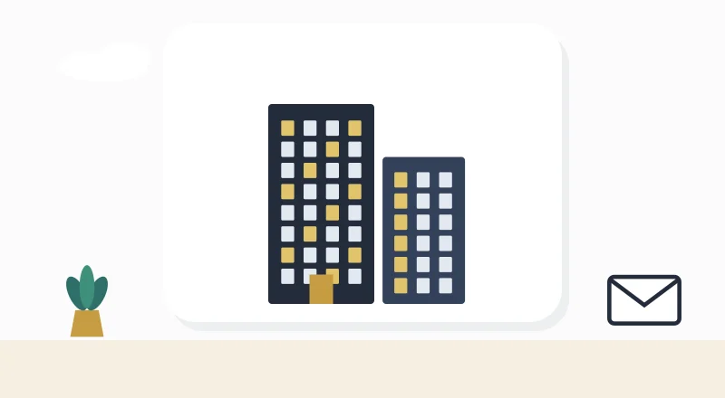 Two apartment blocks with lit windows