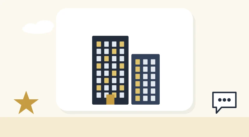 Two apartment blocks with lit windows