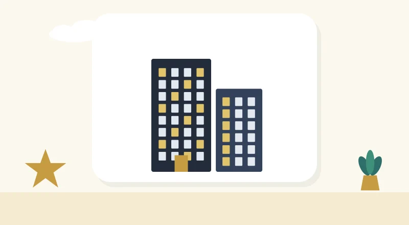 Two apartment blocks with lit windows