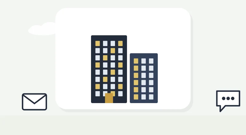 Two apartment blocks with lit windows