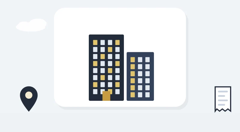 Two apartment blocks with lit windows